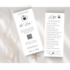 the wedding program is displayed on a white tablecloth with flowers and feathers around it