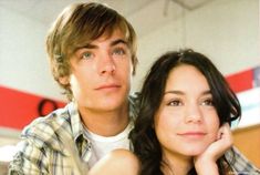 a young man and woman posing for a photo