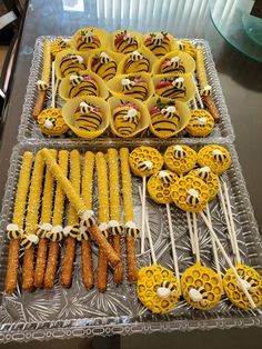 a table topped with lots of yellow and white desserts