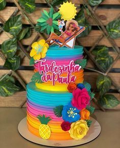 there is a multi layer cake decorated with flowers and the words fridagenha do pulua