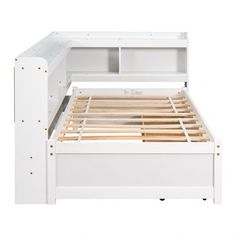 the bed frame is white and has wooden slats