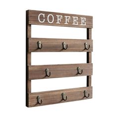 a wooden sign that says coffee with hooks on the front and back of it,