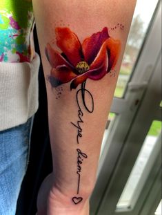 a woman's arm with a flower and the words, love is forever written on it