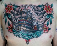 a man with a tattoo on his chest has a boat in the water and flowers around it