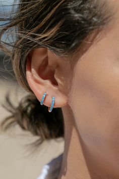 The prettiest blue opal hoops to sweeten your earlobes. These gold and cerulean blue opal huggie hoops shimmy and dance in the light day and night. Team them with with each other or mix and match with our other favorite hoop earrings. ✦ Choose your pair from two different sizes ✦✦ DETAILS ✦✧ Name: Kehaulani (keh-HOU-lah-nee) - Dew from the sky.✧ You will receive 1 pair.✧ Size 1: 10.5 x 2.25mm thick; 8.25mm inner diameter.✧ Size 2: 12.5 x 2.25mm thick; 9.75mm inner diameter.✧ Gold Plated Sterling Blue Opal Earrings, Small Gold Hoop Earrings, Gemstone Hoop Earrings, Small Gold Hoops, Corporate Fashion, Tiny Hoop Earrings, Gold Filled Hoops, Cerulean Blue, Summer Earring