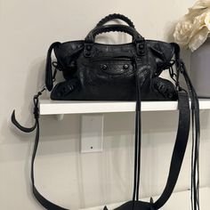 Balenciaga Classic City Bag Very Good Condition No Scratches, Tears Or Wear On Leather Comes With Detachable Shoulder Strap *Some Wear On Metal Hardware L11,8 X H7,5 X W3,9 Inch Original Mirror Not Included - I Lost It This Is An Authentic Balenciaga Agneau Classic Hardware S City In Black. This Chic Tote Is Crafted Of Agneau Lambskin Distressed Leather In Black And Features Rolled Leather Top Handles With Handwoven Whipstitch Detail, An Optional Shoulder Strap The Top Zipper Opens To A Black Fa Designer Black Satchel With Double Handle, Balenciaga Small City Bag, Balenciaga Small City, Balenciaga Classic City Bag, Balenciaga Classic City, Bags Balenciaga, Balenciaga Handbags, Small City, City Bag