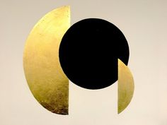 an abstract painting with gold and black circles