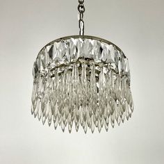 a crystal chandelier hanging from a ceiling