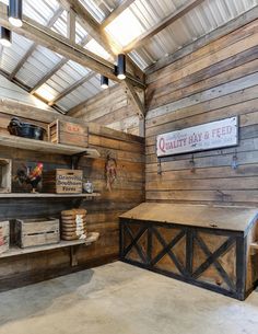 a room with wooden walls and shelves filled with boxes