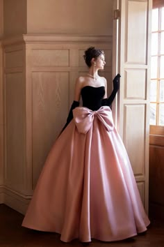 Long Dress With Bow On Back, Pink Black Tie Dress, Dresses With Bows In The Back, Dresses With Big Bows, Dress With Bow In The Back, Dress With Bows On Shoulders, Prom Dress With Gloves, Velvet Ball Gown, Prom Dress With Bow