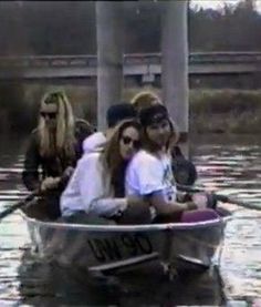 a group of people riding on top of a boat