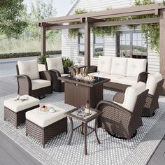 an outdoor living area with wicker furniture