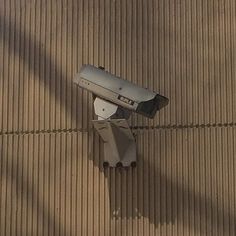 a security camera mounted on the side of a building