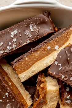 a bowl filled with chocolate and peanut butter bars