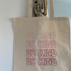 a tote bag with the words be kind of kind on it