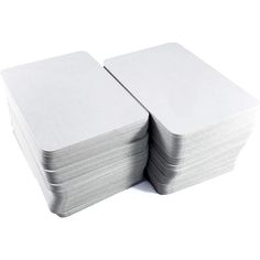 several stacks of white paper stacked on top of each other in front of a white background