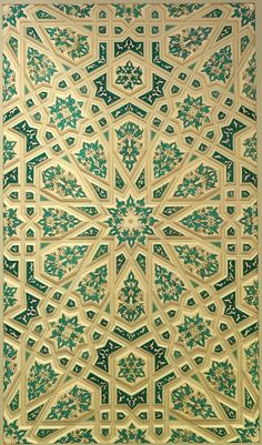 an intricately designed wall panel with green and white designs on the outside, in gold foil