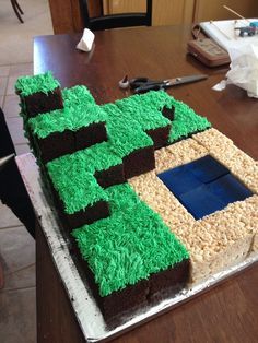 a cake made to look like a house with grass on the outside and dirt on the inside