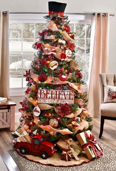 a christmas tree decorated with ribbons and ornaments