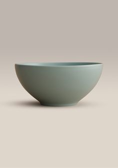 a blue bowl sitting on top of a table