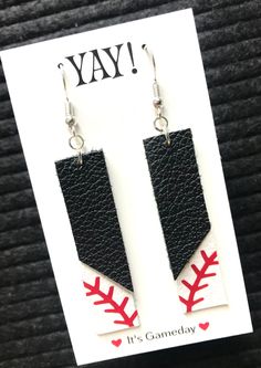 "PLEASE READ: **FREE SHIPPING on orders of $35+ **Ships 2-5 days from order date. These earrings are perfect to coordinate with your BlingirlSpirit hat! Description: **Genuine white leather with red stitch design **Approximately 2\" in length (2 3/4 with the hook) **you choose top color Hook available in base metal or sterling silver (you choose when you order)! Want to add a hat? Please do! If you let me know which hat you would like to add please let me know and I will ship the hat and earring Fake Leather Earrings, Leather Football Earrings, Team Earrings, Which Hat, Sports Earrings, Cricut Earrings, Baseball Earrings, Mom Earrings, Football Earrings