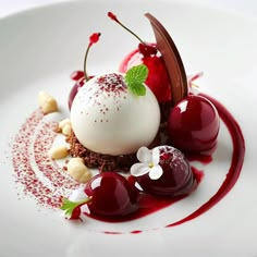 a white plate topped with dessert and cherries