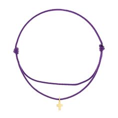 a purple cord bracelet with a gold star charm