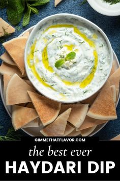 hummus and pita chips on a plate with text overlay that reads the best ever