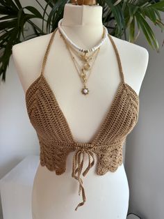 Handmade caramel brown scalloped Crochet Bralette Crop Top with adjustable tie back and tie front This top is made in a beautiful caramel brown yarn with a delicate scalloped body and features a fully adjustable halterneck tie, front tie and a fully adjustable tie up back. Due to its customisable nature, this top would fit someone between the sizes of UK 6/8 to UK12/14. Approximate cup size A - C. Displayed on a UK size 8/10 mannequin. Necklace not included.  PLEASE NOTE - since this is a handma Backless Crochet Top, Handmade Crop Top, Crochet Bra Top, Brown Yarn, Crochet Bra, Daisy Jones, Crochet Bralette, Crochet Inspo, Bralette Crop Top