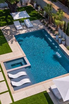 an aerial view of a swimming pool and patio