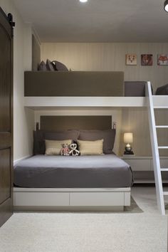 there is a bunk bed with a ladder to the top and bottom beds above it