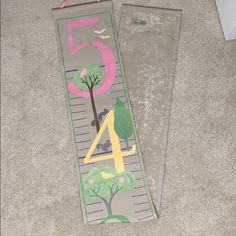 two bookmarks with numbers and trees on them