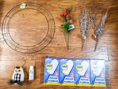 the supplies needed to make this diy wreath are laid out on a wooden table