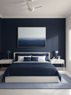 a blue and white bedroom with a large painting on the wall above the headboard