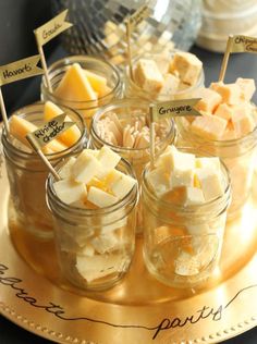 small jars filled with marshmallows on top of a plate