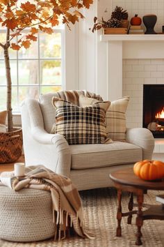 a living room filled with furniture and a fire place under a tree in front of a window