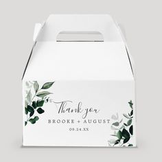 a white thank card box with greenery on it