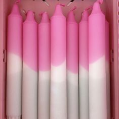 pink and white candles in a pink box