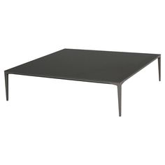 a black table sitting on top of a white floor