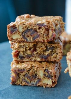 three pieces of fruit and nut bars stacked on top of each other