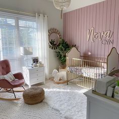 a baby's room with pink and gold accents