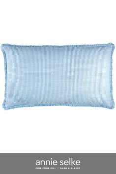 an image of a blue pillow with the name annie selke on it's side