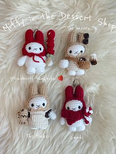 four crocheted keychains are shown on a furry surface