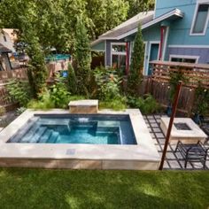 a small backyard with a pool in the middle