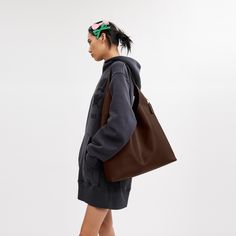 Our Brooklyn is an elegant minimalist silhouette—with a distinctly New York attitude. Crafted of natural grain leather with beautiful texture and soft feel this generously sized hobo style features a spacious interior with room for a 15” laptop and a snap pocket for access to essentials. The streamlined 39 is finished with a comfortable wide shoulder strap and an easy magnetic snap closure. | Coach Brooklyn Shoulder Bag 39 - Women's Purses - Brass/maple Coach Brooklyn Shoulder Bag Outfit, Coach Hobo Bags Outfit, Working Bag For Women, Coach Brooklyn Shoulder Bag 39, Brooklyn Coach Bag, Suede Shoulder Bag, Coach Brooklyn 28, Coach Brooklyn Shoulder Bag, Coach Brooklyn