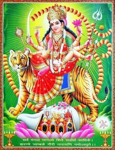 the hindu goddess sitting on top of a tiger