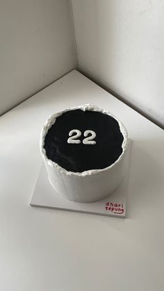 a cake with the number twenty two in it's center on a white surface