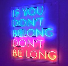 a neon sign that says if you don't belong belonging don't be long