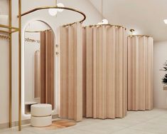 the interior of a modern bathroom with beige shower curtains and round stools on the floor