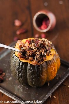 a plate topped with an acorn filled with food